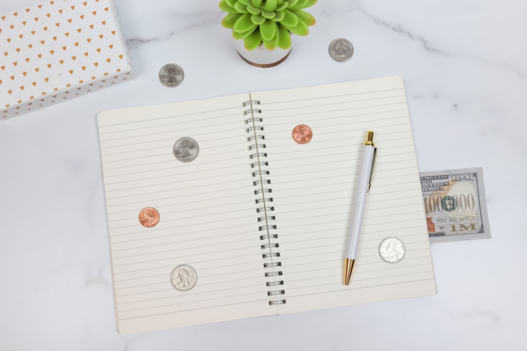 This feminine styled stock photo features money, cash, and coins and is perfect for business, accounting, or personal finance content.